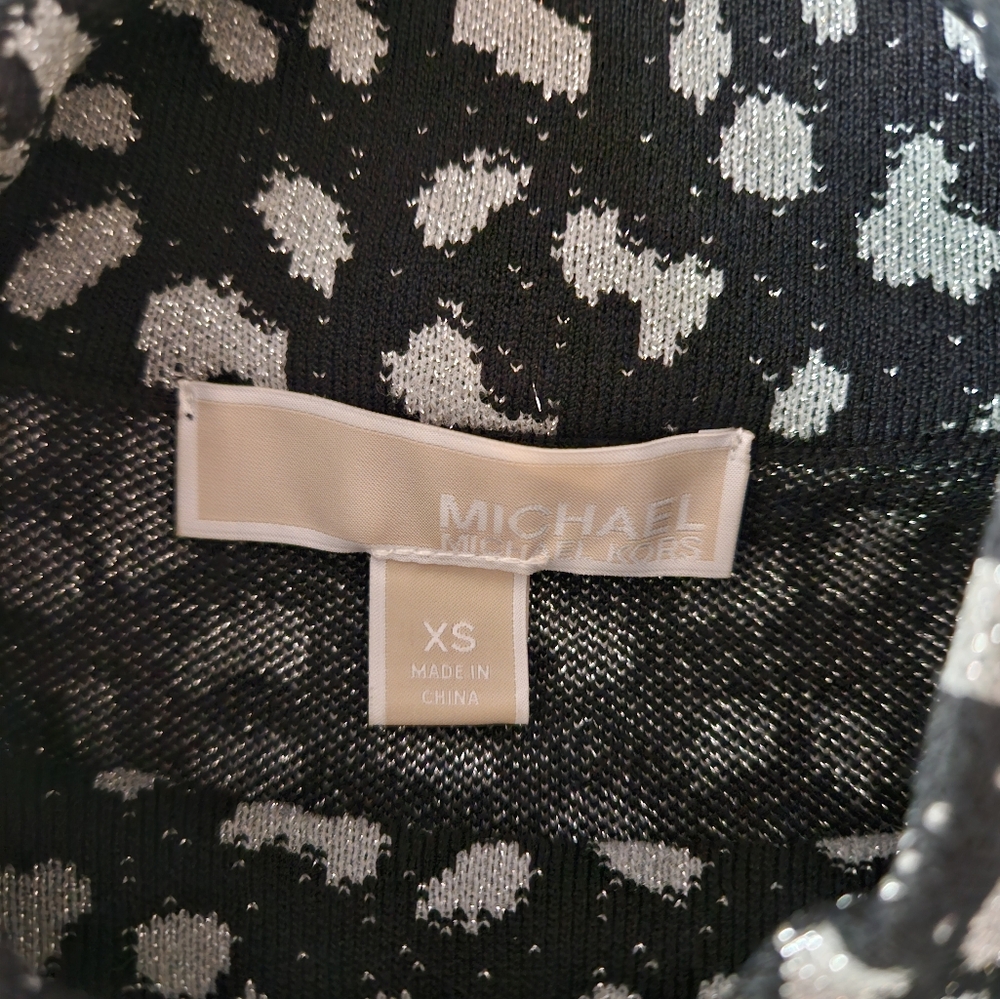Michael Michael Kors body con Cheetah print with bell sleeve.